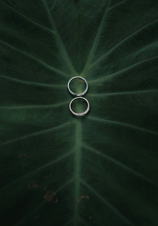 two silver-colored rings