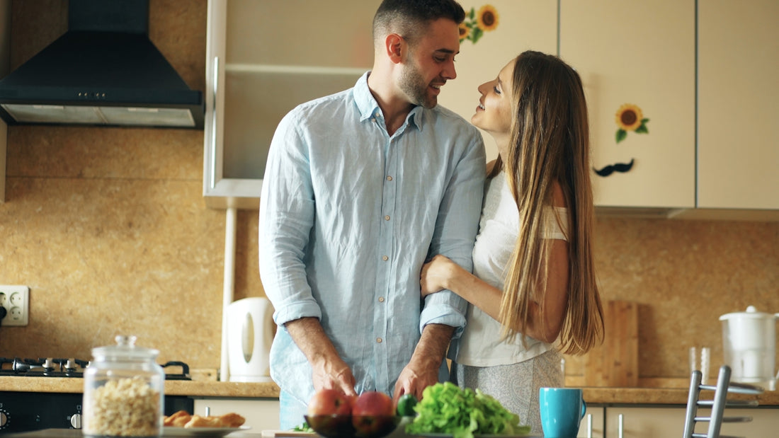 Couple preparing food together in a kitchen