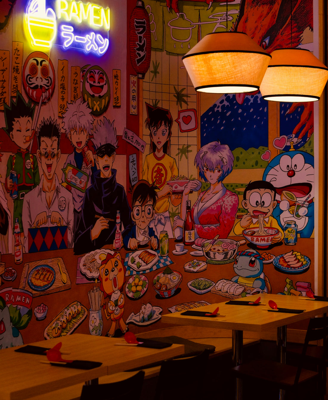 Anime characters and ramen displayed on wall