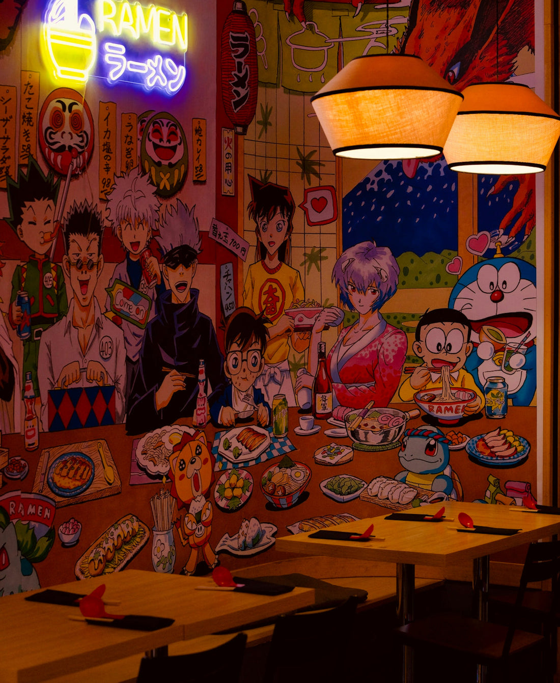 Anime characters and ramen displayed on wall