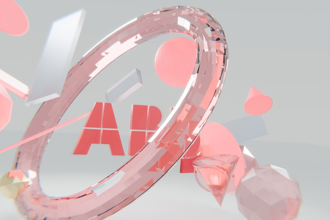 Faceted pink ring, 'app' text, and abstract geometric shapes.