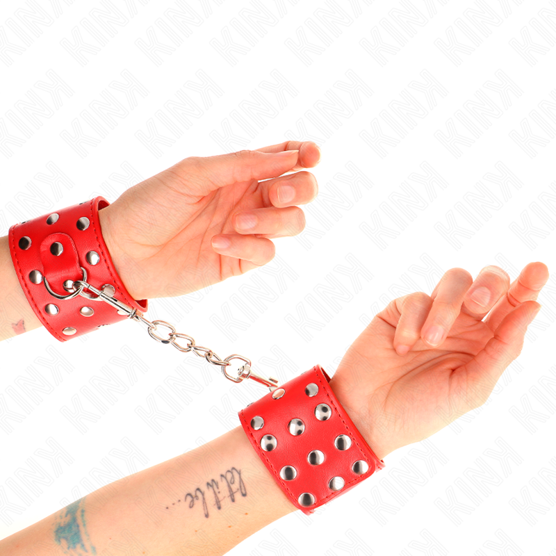 KINK - WRIST RESTRAINTS WITH SNAP FASTEN FULL OF RIVETS RED ADJUSTABLE 19-24 CM X 5.5 CM - My naughty haven #